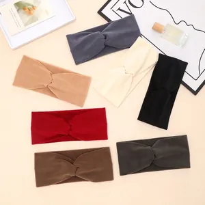 Collection of soft knitted criss-cross headbands in seven stylish autumn colors