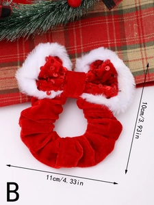 Dettaglio dell'elastico natalizio in velluto rosso con bordo in peluche e paillettes