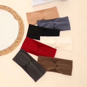 Soft fleece wide headband for women featuring twist knot design in multiple winter colors