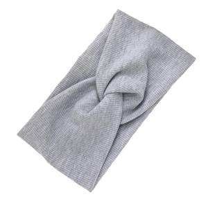 Knitted grey cross knotted headband with ribbed texture for sports and face washing