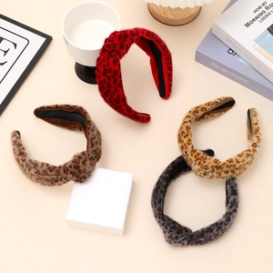 Leopard print plush knotted headbands in red, brown, tan, and gray for autumn winter styles