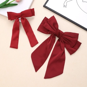 Elegant red bow hair clip set with long ribbons made of premium matte satin silk