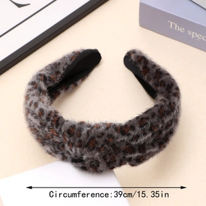 Detail of plush leopard print headband showing 39cm circumference and soft twisted knot