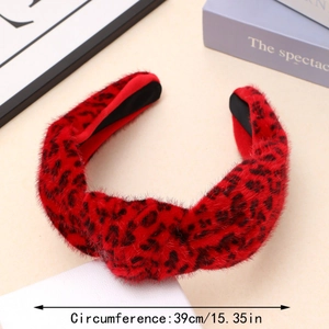 Detail view of red faux fur leopard print knotted headband showing 39cm circumference