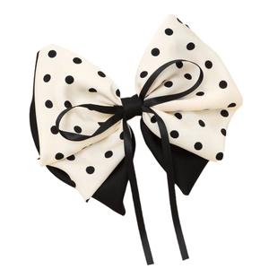 Fermaglio per capelli con fiocco a pois crema e nero per uno stile elegante e unico