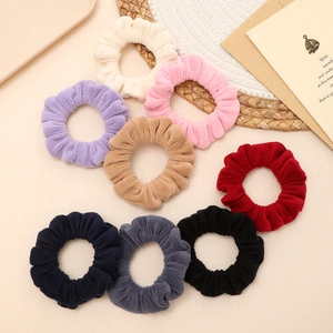Set of 8 soft plush hair scrunchies in various colors including cream pink and grey
