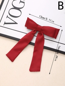 Detailed dimension guide for the red bow hair clip showing 13cm width and 16cm height