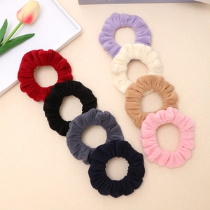 Set of 8 thick flannel scrunchies in assorted colors for high ponytail hairstyles