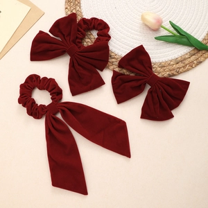 Three-piece set of deep red velvet oversized bow hair scrunchies and a matching hair clip