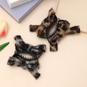 Plush leopard print hair claw clips in brown and grey faux fur for women's hairstyling