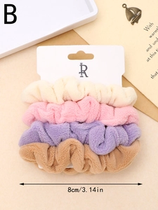 Set of four 8cm soft plush hair ties in cream, pink, purple and brown on card