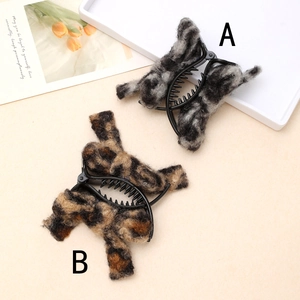 Plush leopard and grey marble print bow hair claws for bun styling and hair accessories