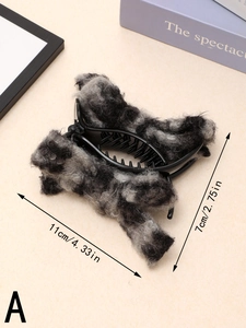 Detail view of plush leopard print bow hair claw clip measuring 11cm by 7cm