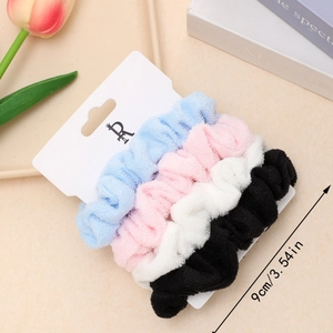4-pack plush velvet hair scrunchies in pastel colors on display card for women