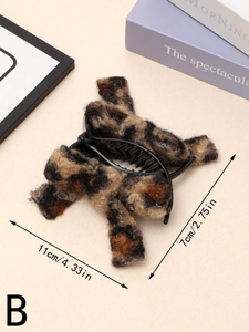 Detailed view of the 11cm leopard print plush hair claw clip with size measurements