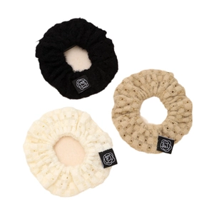 Three-piece set of knitted lace scrunchies in black, beige and cream with rose labels