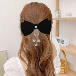 Elegant black velvet bow hair clip with vintage silver tassels for wedding hairstyles
