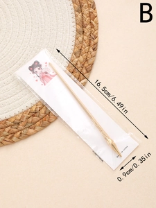 Dettaglio di un bastoncino per capelli dorato da 16,5 cm stile pennello con decori