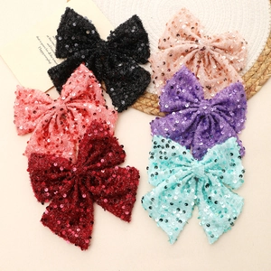 Large handmade sequin bow hair clips in six assorted colors for sweet festive styling