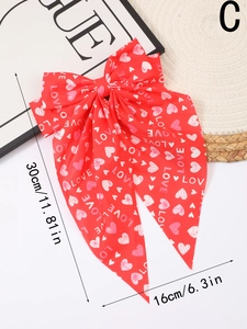 Detailed view of red bow hair clip with white hearts and LOVE print, size 30x16cm