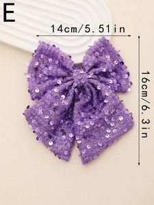 Detailed view of a purple sequin bow hair clip with size dimensions 14x16 cm