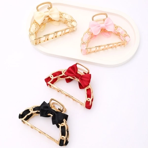 Elegant bow hair claw clips with gold metal chains in beige, pink, red, and black colors