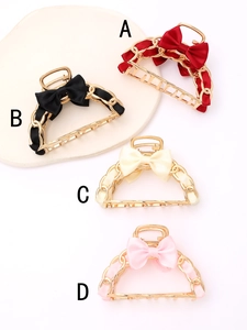 Set of four butterfly bow hair clips in gold alloy with red, black, beige and pink ribbons
