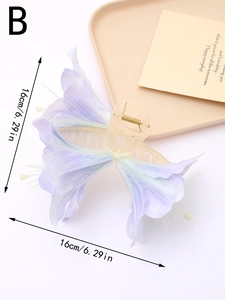 Detail view of large purple lily hair claw clip with fabric petals and size dimensions