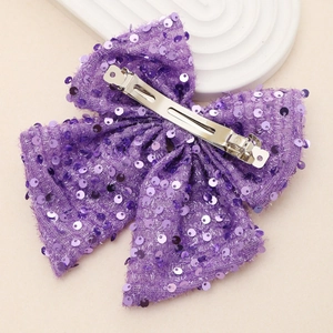 Large violet sequin bow hair clip for women featuring a shiny metallic alligator grip