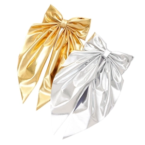 Elegant gold and silver metallic bow hair clips with long streamers for party hairstyles