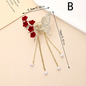 Elegante pinza per capelli a farfalla dorata con strass bianchi, fiori rossi e nappe di perle