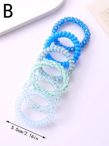Blue spiral hair ties set with stars and glitter details, 5.5cm diameter measurement