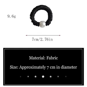 Elegant black satin scrunchie with a large pearl bead, 7cm diameter fabric hair tie