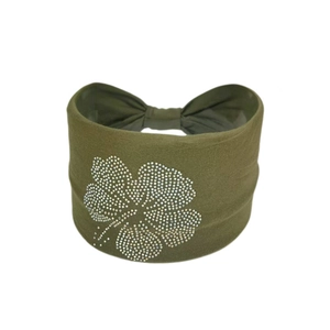 Detail of army green knitted wide headband with white rhinestone clover flower pattern