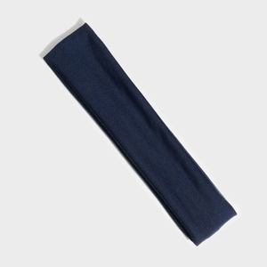 Close-up of deep blue elastic knit headband showing soft fabric texture and stitching