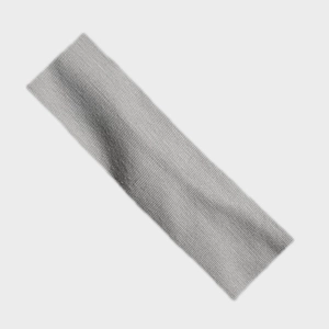 Close-up of grey elastic ribbed knit sports headband showing fine texture and material