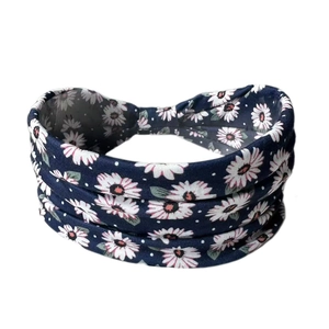 Navy blue elastic yoga headband with white daisy floral and polka dot patterns