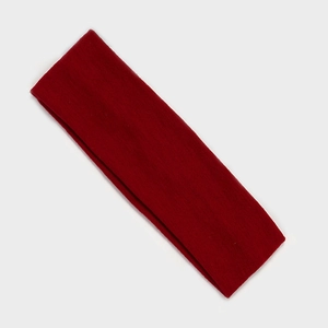 Detailed view of the dark red knitted elastic sports headband with ribbed texture design