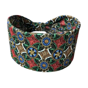 Detailed view of wide bohemian headband with vibrant floral patterns and elastic fabric