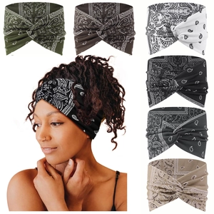 Close-up of bohemian paisley headbands in multiple colors with a stylish twisted knot design