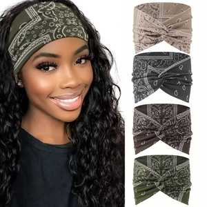Detail of bohemian floral print elastic headbands with twisted cross knot design for women