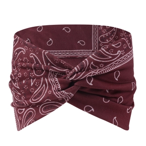 Close-up of bohemian burgundy paisley headband with a stylish twisted cross knot design