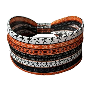 Bohemian style printed sports headband with tribal patterns in orange black and white
