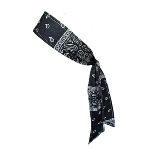 Close-up of black paisley workout headband with a stylish knotted design and elastic fabric