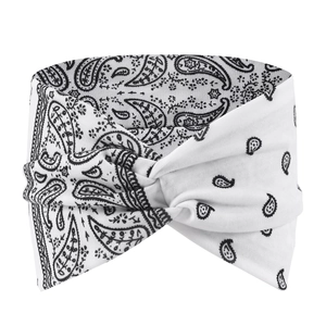 Detail of white paisley yoga headband featuring a bohemian criss-cross knot design