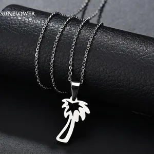 Minimalist stainless steel necklace featuring a hollow palm tree pendant on a silver link chain