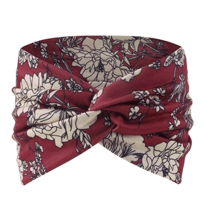 Close-up of bohemian burgundy elastic headband with vintage cream floral print and knot detail