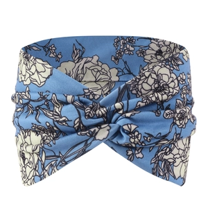 Detailed view of bohemian blue floral twisted headband with elastic stretch fabric