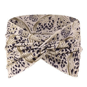 Detail of bohemian leopard print yoga headband with soft beige fabric and elastic knot