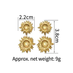Macro view of 18K gold-plated sunflower drop earrings showing dimensions 2.2cm by 3.8cm